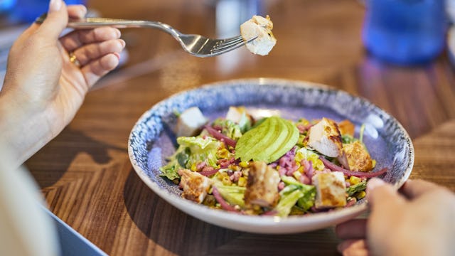 IC, Icon of the Seas, dish served at Pier 7, Surfside, fork held above dish, salad,