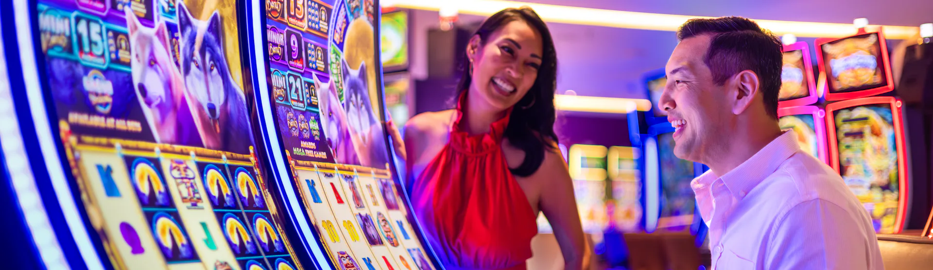 IC, Icon of the Seas, casino, couple at Casino Royale slot machine, fun, games, nightlife, excitement, anticipation,