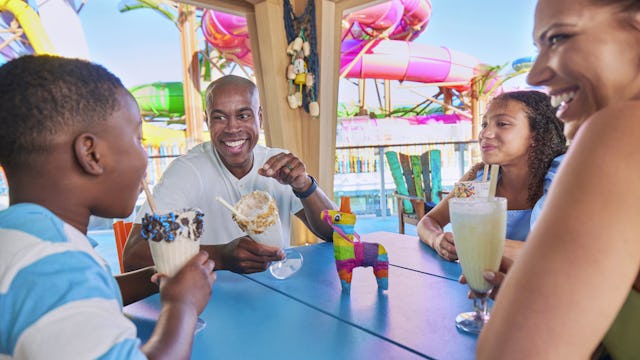 Family enjoying milkshakes at Basecamp onboard Icon of the Seas, sweets, relaxing, fun.