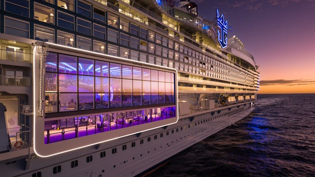 IC, Icon of the Seas, aerials, close-up of port side of ship at angle, view into Pearl Café, perspective, POV looking toward aft, sunset, evening, dusk, orange colors.