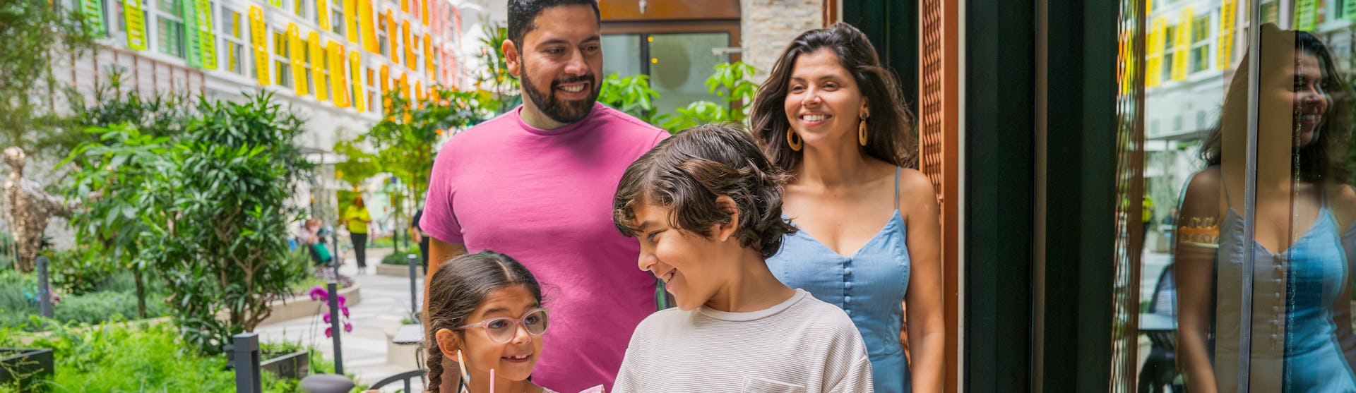 Guests walking through Central Park on Icon of the Seas