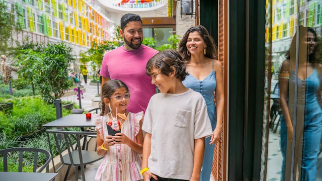 Guests walking through Central Park on Icon of the Seas