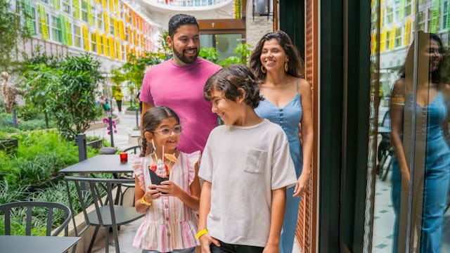 Guests walking through Central Park on Icon of the Seas