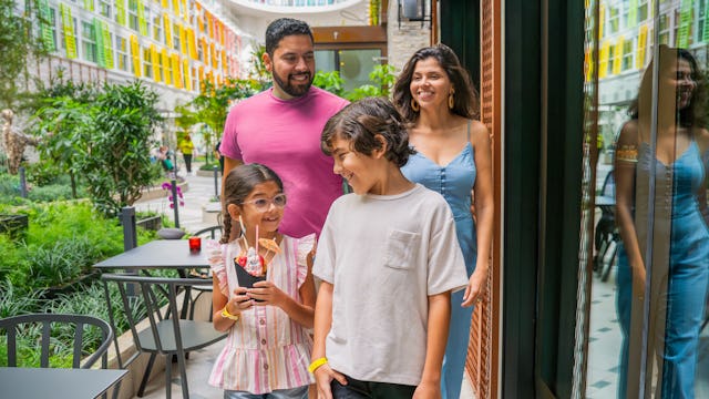Guests walking through Central Park on Icon of the Seas