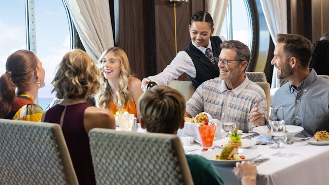 A family having dinner on board of the Icon of the Seas