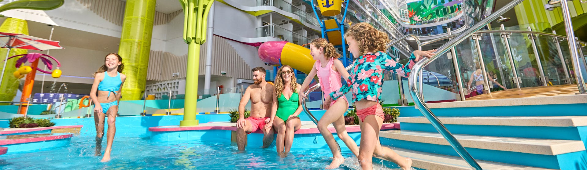 A family enjoying a moment in one of the many pools on board of Icon of the Seas.