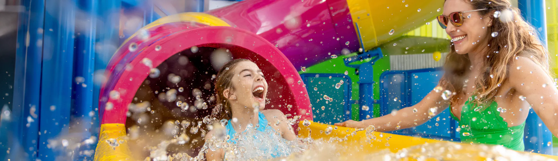 Mother and daughter enjoying one of the many waterslides on board of the Icon of the Seas.