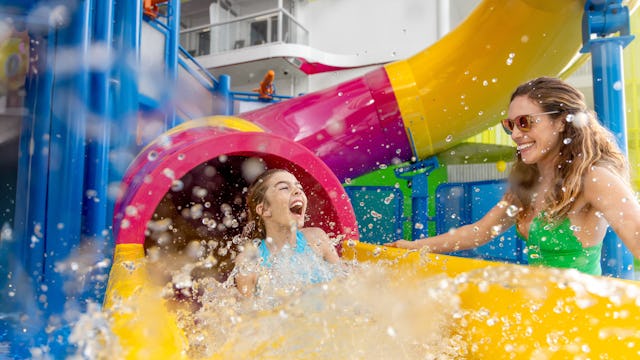 Mother and daughter enjoying one of the many waterslides on board of the Icon of the Seas.