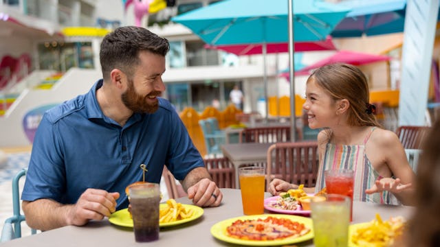 Family having a great time and enjoying some food at Surfside on board of Icon of the Seas.