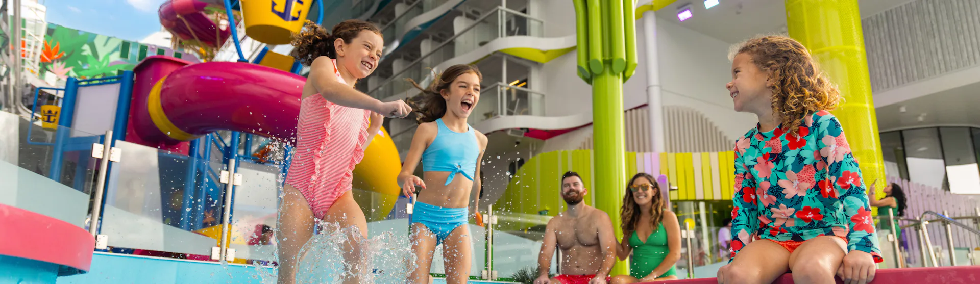 A family and their kids enjoying some quality time at Surfside Splashaway Bay, on board of the Icon on the Seas.