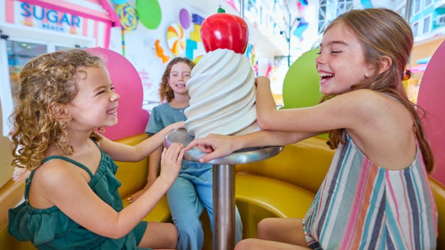 Children enjoying Surfside Carousel on board of the Icon of the Seas.
