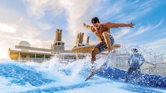 Surfing at the FlowRider® surfing simulator on Icon of the Seas.