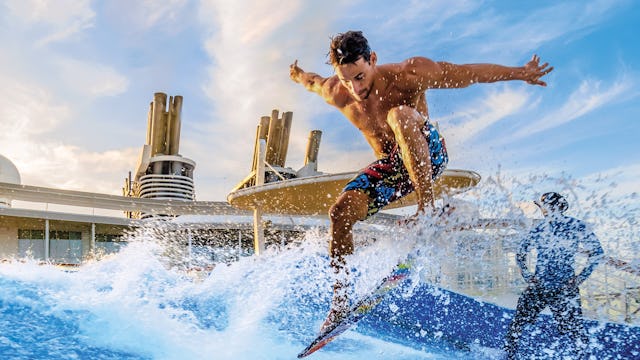 Surfing at the FlowRider® surfing simulator on Icon of the Seas.
