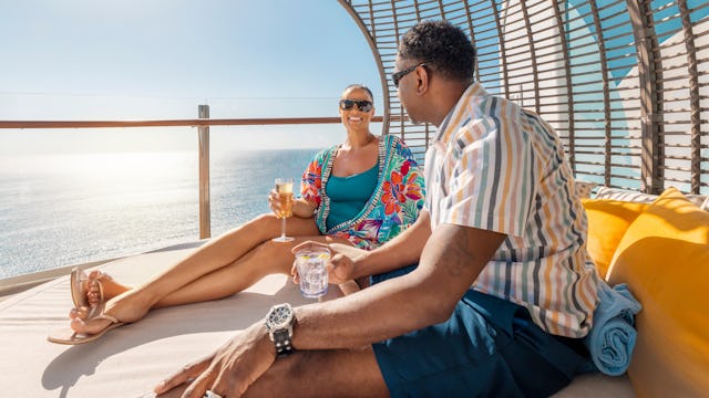 People enjoying some leisure time at the Suite Sun Deck, on board of the Icon of the Seas.