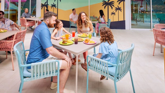 A family enjoying some food together at Surfside Eatery on board of Icon of the Seas